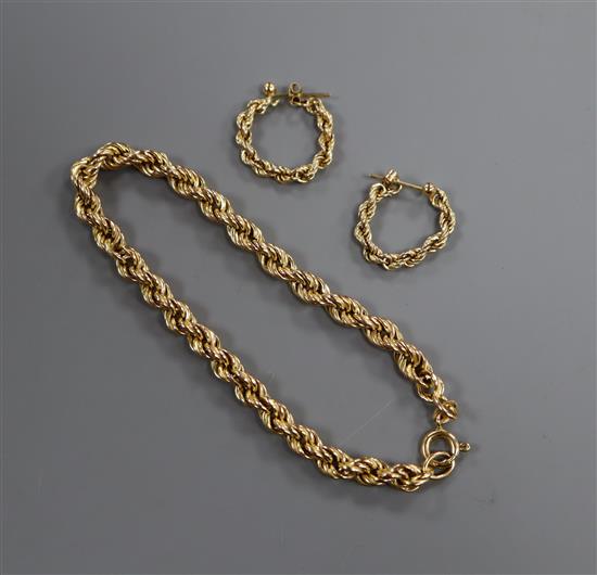 A 9ct gold ropetwist bracelet and a pair of similar earrings.